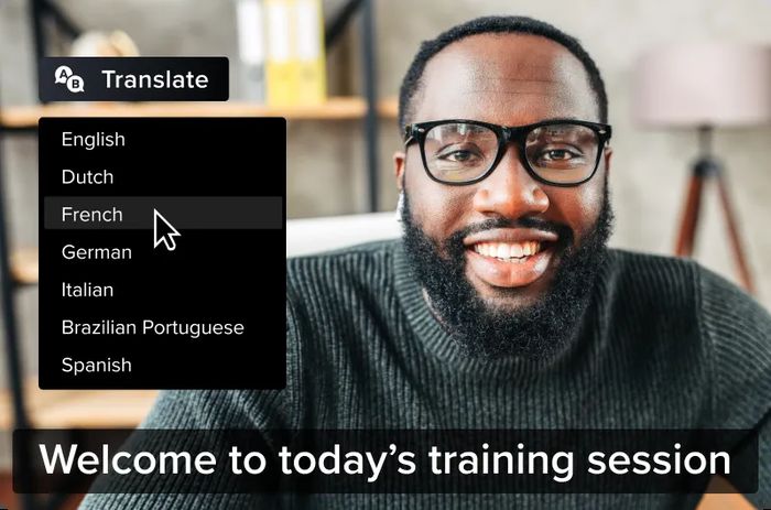 Camtasia - an image of a man with the caption "welcome to today's training session" and a dropdown indicating the other languages available for caption translation