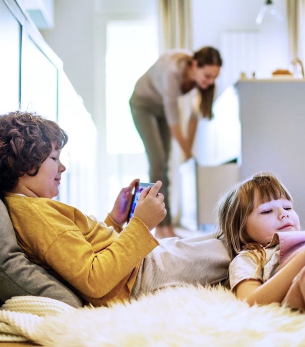 Kids browsing internet safely with Norton 360 Deluxe.